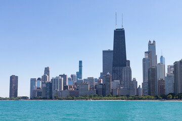 Fototapeta na wymiar Chicago Skyline along Lake Michigan during the Summer with a Clear Blue Sky
