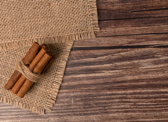 Cinnamon sticks on burlap. Seasoning in cooking.
