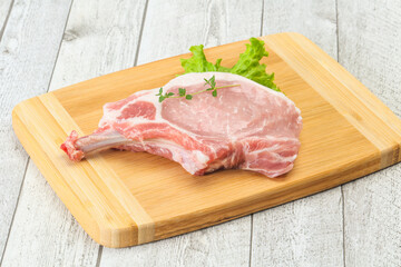 Raw pork bone steak over wooden