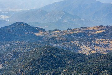 Fototapeta na wymiar View on Taurus mountains and villages from the summit of Tahtali mountain