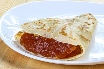 Delicous pancake with fruit jam
