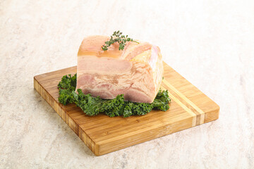 Cut of pork bacon over board