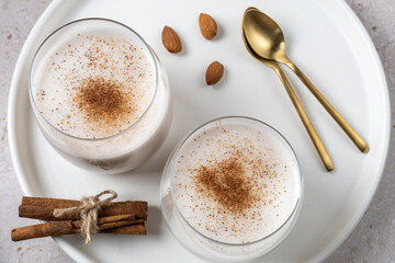 Close-up of Christmas drinks. Vegan Eggnog in glasses, alternative dairy-free drink.