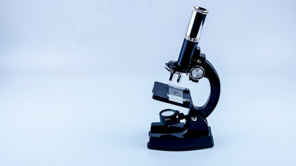 laboratory microscope with research sample on white background