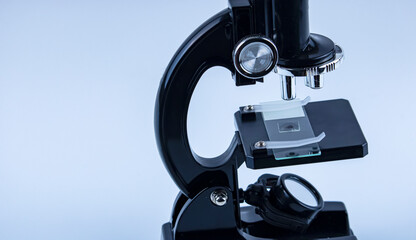 laboratory microscope with research sample on white background