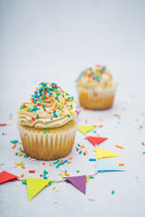 cupcake with sprinkles on a marble background