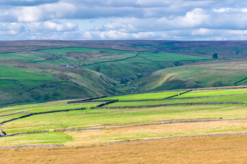 Fototapeta na wymiar A view across the moors and valleys close to Hebden Bridge, Yorkshire, UK in summertime