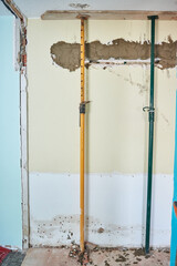 Construction struts support the roof of a house under construction
