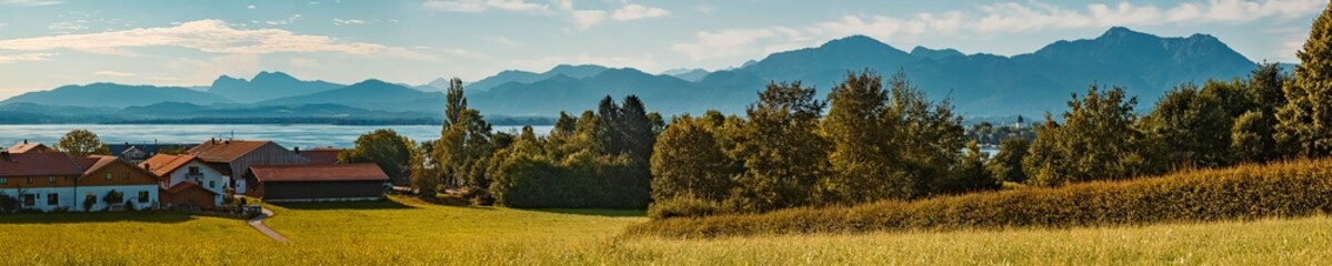 High resolution stitched panorama of a beautiful alpine summer view at the famous Chiemsee, Aisching, Bavaria, Germany