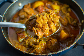  Delicious tasty spicy hot well cooked chicken curry. Famous in kolkata and all over India. Chicken curry is spicy cooked meat. Bengali dinner, meal.