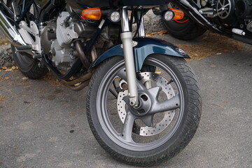 Fototapeta na wymiar Bikers' equipment and their motorcycles, motors, wheels, tanks, wings, helmets.