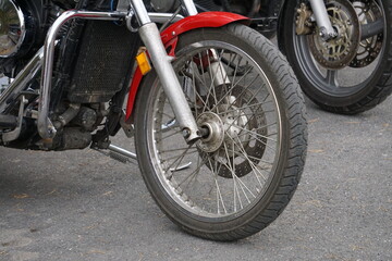 Bikers' equipment and their motorcycles, motors, wheels, tanks, wings, helmets.