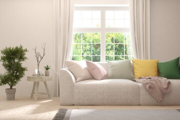 White living room with sofa and summer landscape in window. Scandinavian interior design. 3D illustration