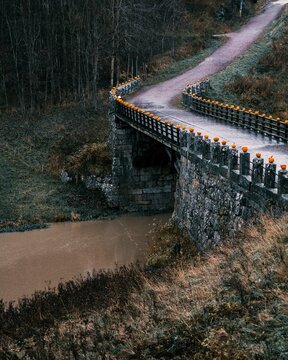 Old bridge made of rocks. Multiple halloween pumpkins on the edge. Halikko, Salo, Finland