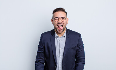 young handsome man with cheerful and rebellious attitude, joking and sticking tongue out....