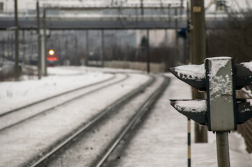 Fototapeta na wymiar Semaphore at the railway station in winter. Transport concept.