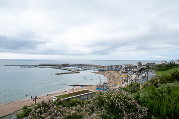 Views of Cobb harbour and sandy beach at Lyme Regis, in Dorset, south England