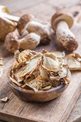 Boletus wild dried mushrooms set, on old dark wooden table background