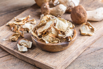 Boletus wild dried mushrooms set, on old dark wooden table background