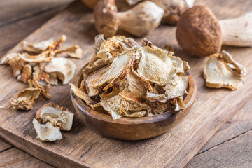 Boletus wild dried mushrooms set, on old dark wooden table background