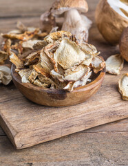 Boletus wild dried mushrooms set, on old dark wooden table background