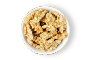 Peeled walnut kernels in a bowl. Isolated on a white background. Nuts contain vegetable protein and vitamins. For a healthy and vegetarian diet