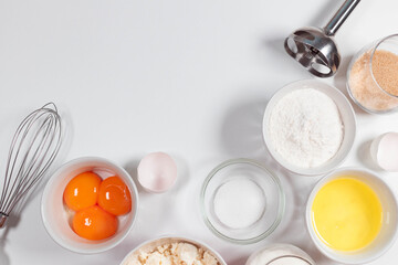 Baking ingredients and cooking utensil with copy space on white background. Top view, copy space