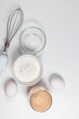Fototapeta na wymiar Ingredients and utensils for baking on a white background.