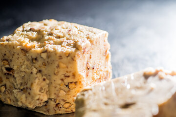 Light dough with nuts, seeds and almonds. Sweet toffee with nuts