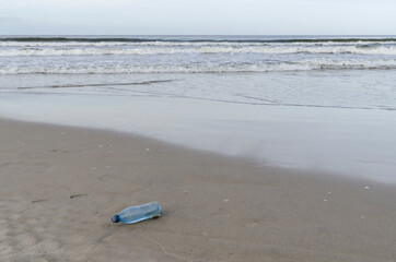Fototapeta na wymiar plastic bottle rubbish dropped on the beach 