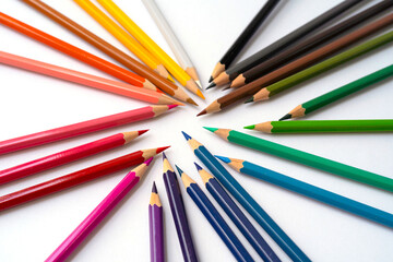 Fototapeta premium Colorful multicolored pencils on white background. Education, Business and finance concept with copy space. Art