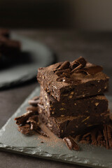 Chocolate Brownie with banana and almond on slate