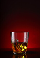 a glass with a drink and ice