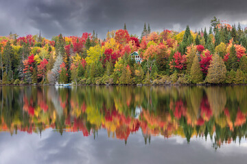 Lac Creuxl in Autumn showing fall colors in cottage country, Quebec Canada. - 465380501