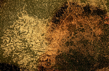 Gold and bronze glitter color confetti dots splash on black. Abstract glow shiny background.