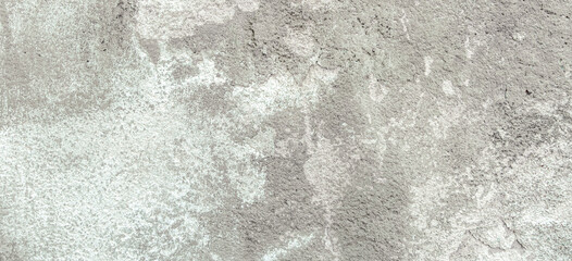 Grey plaster wall with peel grey stucco texture background. Decayed cracked rough abstract wall surface