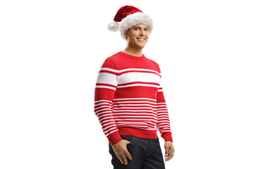 Smiling man wearing a christmas santa hat and a red sweater