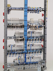 The reverse side of the electrical panel assembly. Connecting the modules using the mounting wire in the switchboards.