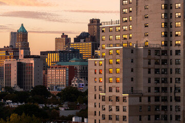 Rooftop view of Sunset reflected in apartment windows