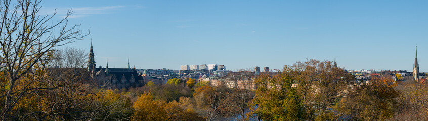Skyline with the old Gothic museum building with towers from 1873 and the east and north districts of Stockholm a colorful autumn day