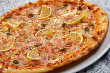 fresh pizza on the white plate