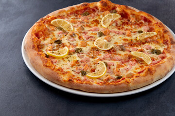 fresh pizza on the white plate