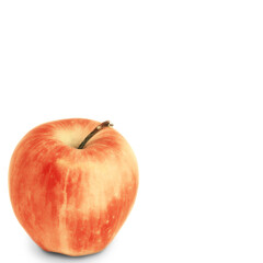 Simple composition with an apple. Red apple on an isolated background. Ripe apple in the corner on a white background. Fresh ripe fruit
