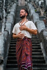 Man at temple meditating