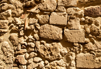Yellow orange warm sandstone limestone wall abstract background.