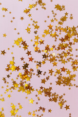 golden stars on pink background, greeting card template with empty space for text
