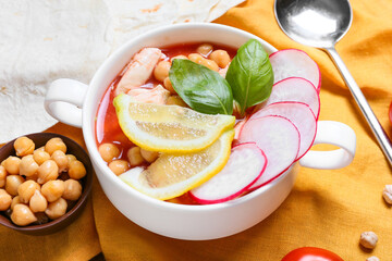Pot with delicious pozole soup on table, closeup