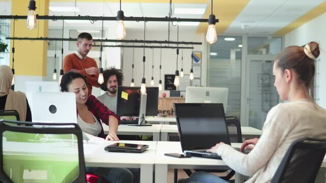 Creative planning and working mobile application design team in the startup office.