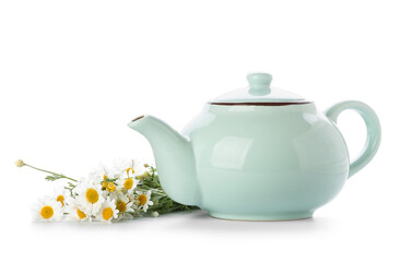 Teapot of natural tea and chamomile flowers on white background