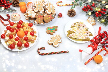 Christmas new year dishes, traditional holiday salad of cheese, tangerines, grapes and honey, for vegan food, fir branches and cones and decorations, food design idea, place for recipe, flat lay,